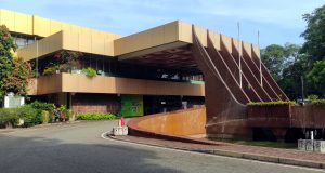 
Colombo Public Library, a modern beige building with large windows.
