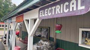 A storefront with signs that say things like Electrical, Plumbing, Hunting, Fishing, etc.