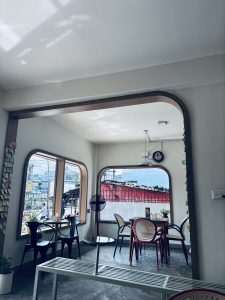 A bright and modern café interior featuring a minimalist design. 