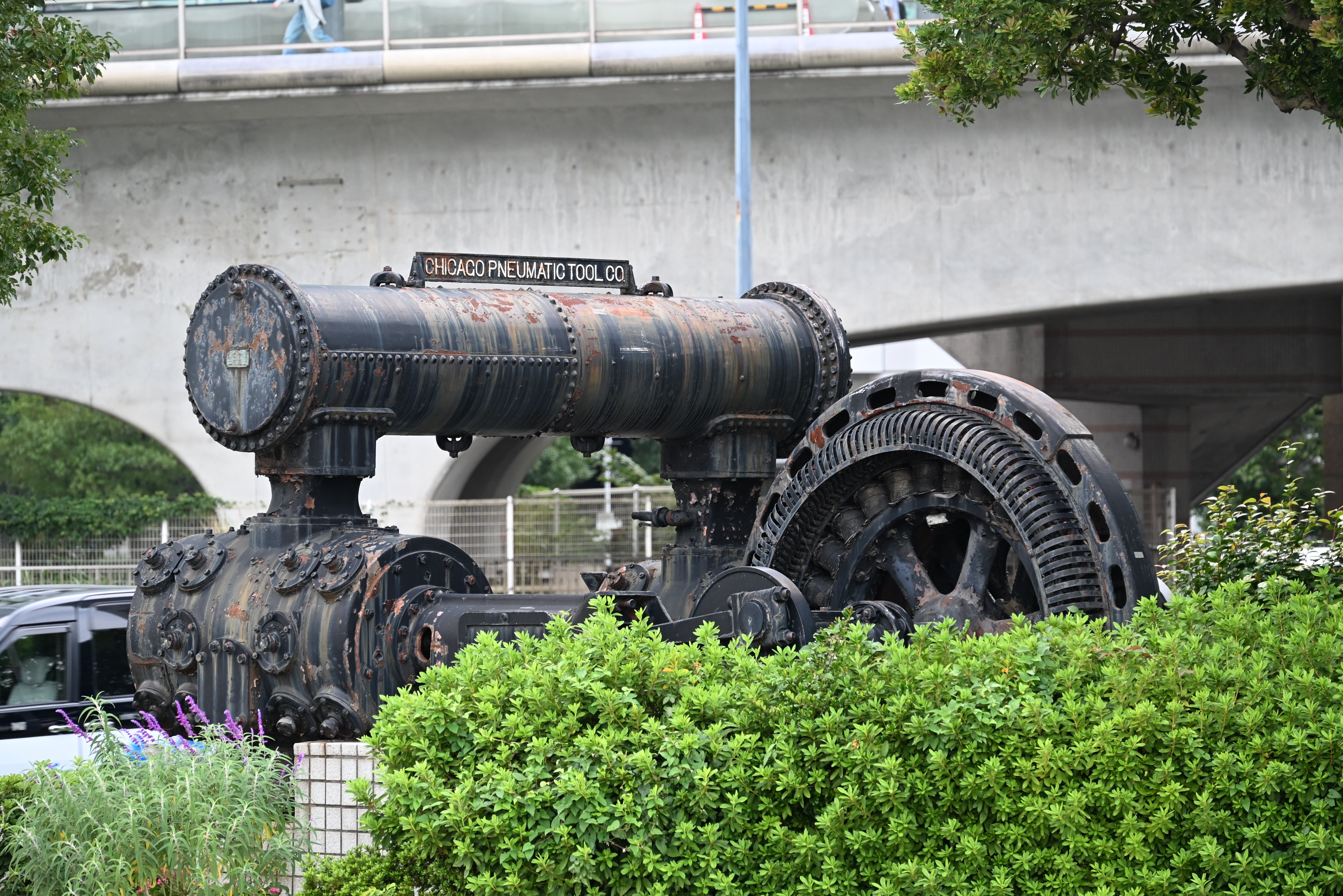 The rusted pneumatic tool of the Former Yokohama Dock Air Compressor Monument outdoors.