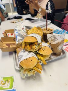 Burgers, fries, iced chocolate, and sandwiches served at a casual restaurant.
