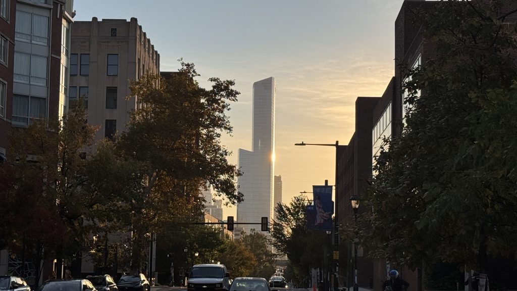 Looking east down Walnut Street at A tall sky scraper in Philadelphia. It’s at sunrise.