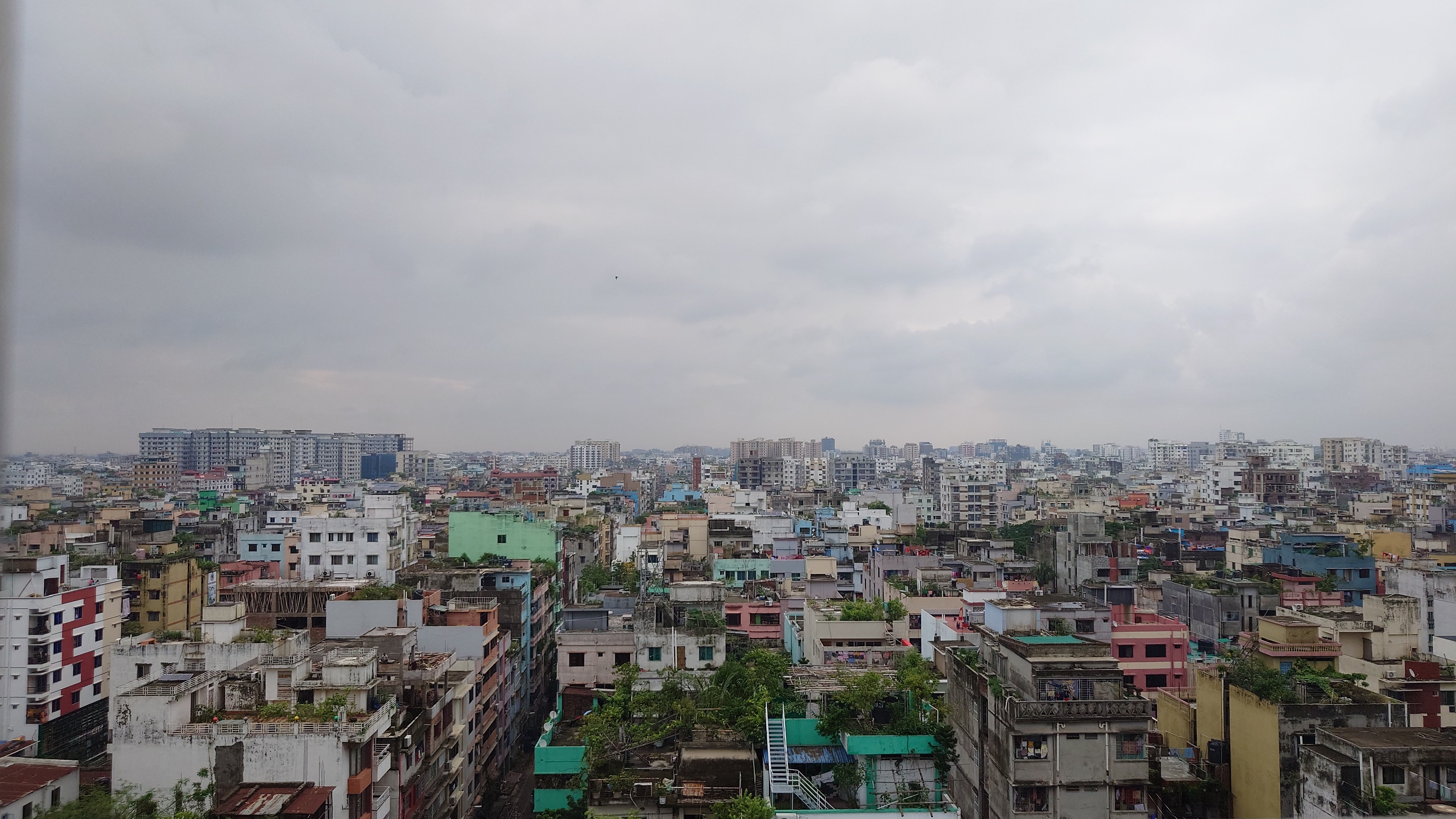 A panoramic view of the city skyline from a high-rise building, showcasing tall buildings and the urban landscape of Mohammadpur, Dhaka, Bangladesh.