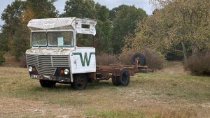 An RV with everything cut off back of the cab, except the foundational framework.