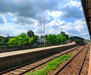 A railway track in Bangladesh. People are waiting for their train to arrive. The silence here is loud with a thousand untold departures and arrivals.