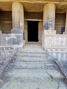 A view of Cave 67 at Kanheri Caves, Mumbai. The stone pillars, carvings, and worn steps reflect the age and beauty of this ancient rock-cut structure. 