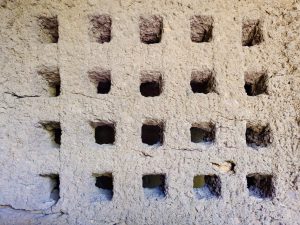 A close look at small square cavities carved into the stone wall at Kanheri Caves, Borivali, Mumbai, shows the detailed handwork of early builders. 