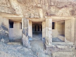 A front view of Cave 95 at Kanheri Caves in Borivali, Mumbai. The stone pillars and carved openings show the ancient rock-cut architecture. 