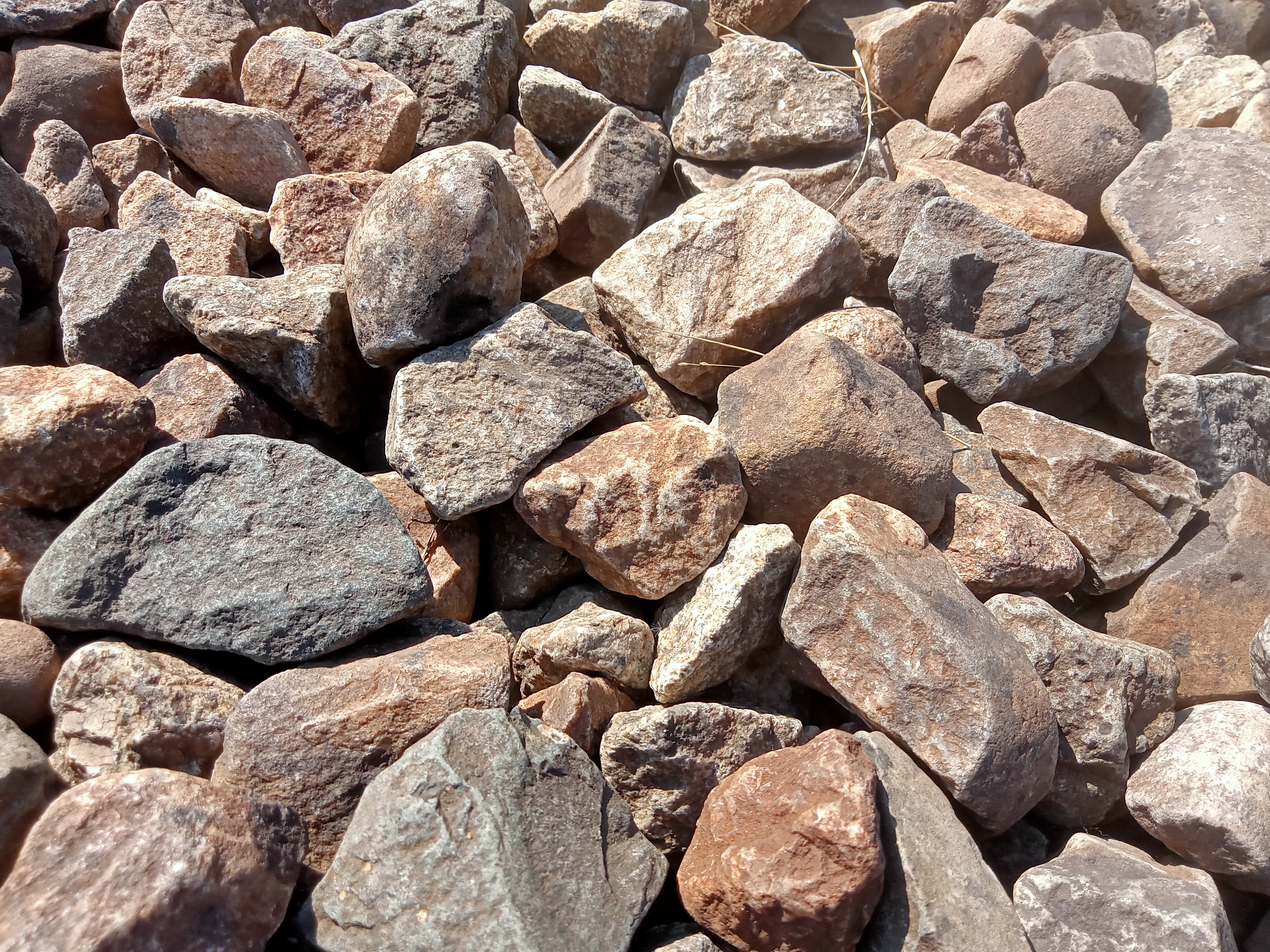 A close-up of mixed rocks in gray, brown, and tan shades, found in Kawtoli, Brahmanbaria, Bangladesh.