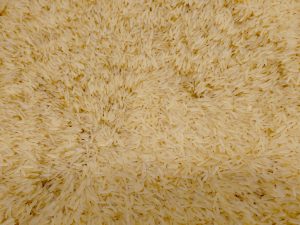 Long grain basmati rice is displayed in bulk at a hypermarket in Kozhikode. The light yellow grains show the natural colour after processing, ready for biryani and daily meals. 