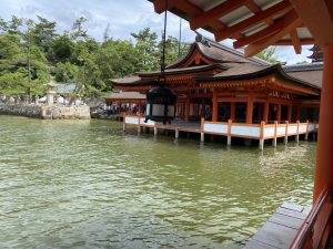 A picture of a Maroudou Shrine at Itsukushima Shrine on Miyajima Island in Hiroshima, Japan. Photographed from the corridor at high tide.