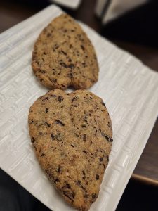 Two crispy, leaf-shaped veg cutlet snacks served on a white plate, captured in Malabar Hill, Mumbai, an appetizing and straightforward food moment.