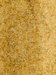 Golden yellow basmati rice is seen in a hypermarket in Kozhikode. The vibrant grains give a warm look, showing a variety often chosen for flavourful and aromatic rice dishes. 