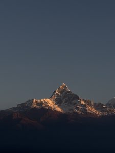 Fishtail Mountain View with snow and a clear view of the sky, clicked at evening time. 