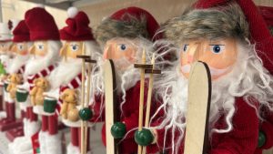 A row of Christmas nutcrackers, the left side closeup, fading away on the left.