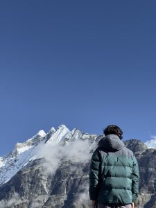 A man staring at the beautiful Langtang Lirung