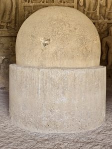 A stone stupa inside the Kanheri Caves, carved from a single rock. This sacred structure reflects the peaceful Buddhist heritage of the site. 