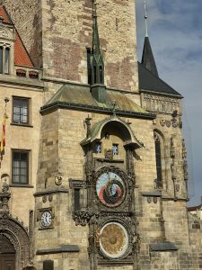 The Prague Astronomical Clock with golden dials and Gothic design on the Old Town Hall.