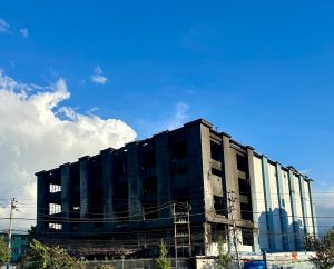 A Burnt structure standing tall on a clear blue sky implying hope and that one day it will rise again like a phoenix!