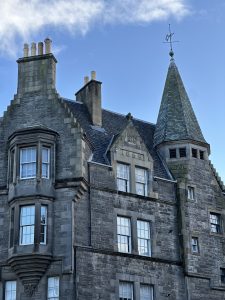 A stunning example of Edinburgh&rsquo;s historic stone architecture, complete with a turret, tall chimneys, and Victorian-era detailing.