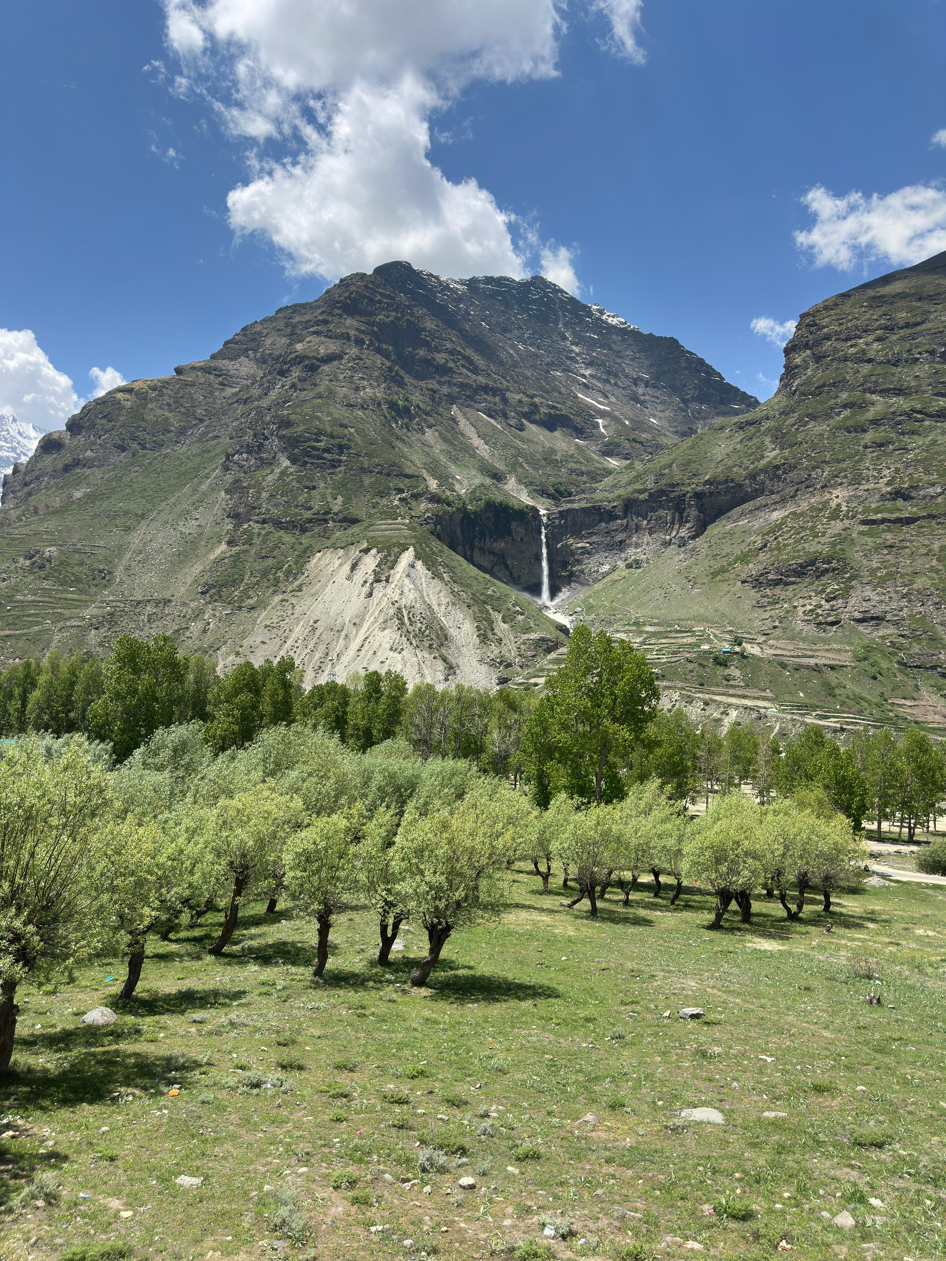 Apple trees, open meadows, and mountains that touch the sky.