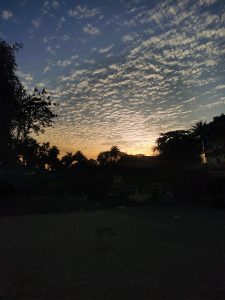 The sun sinks into the horizon, painting the sky with calm, warmth, and fading light.