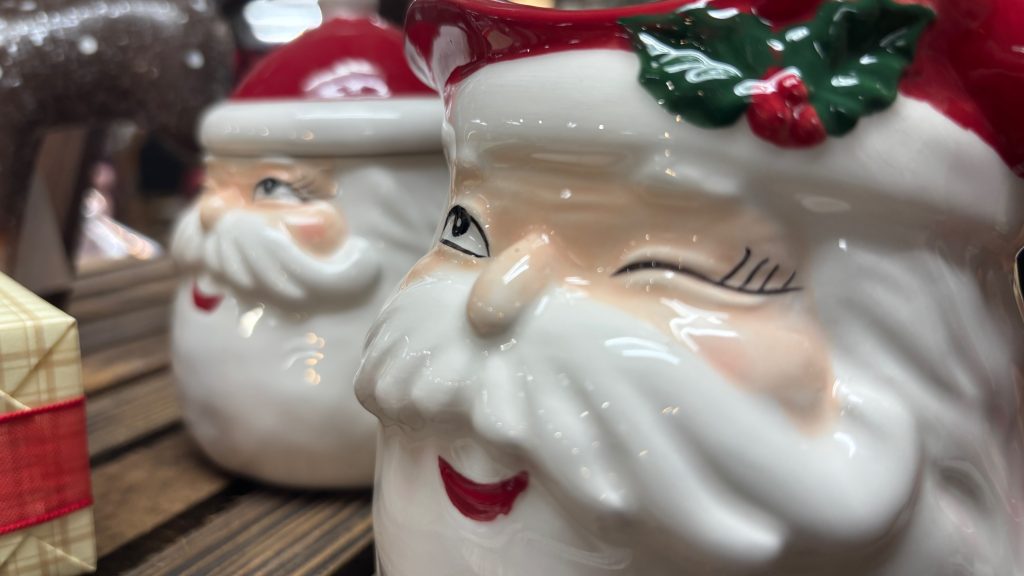 Two holiday mugs with the face...