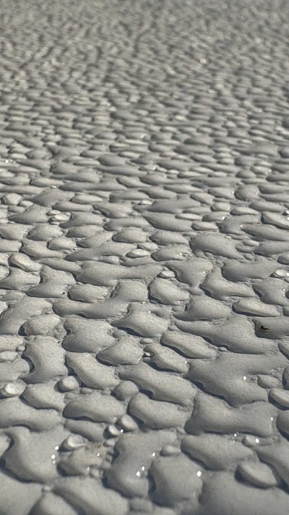 Drops on a table surface at dusk
