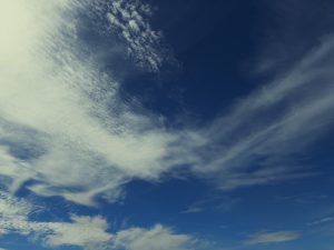 Light clouds against a blue sky.
