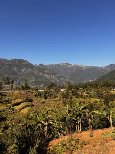 

A wide view of Nepal&rsquo;s mountains under a clear blue sky.