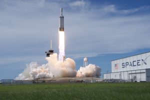 A SpaceX Falcon Heavy rocket launches NOAA’s GOES-U satellite from NASA’s Kennedy Space Center. The weather is clear, and the rocket produces massive plumes. 