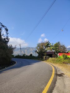 A winding road stretches away from the camera,