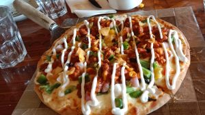 Close-up of a freshly prepared vegetable pizza
