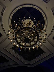 Elegant crystal chandelier with hanging glass prisms.