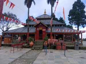 Yagyasala Temple with a sloped roof in a peaceful outdoor setting, located in Resunga, Gulmi, Nepal.

