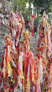 Tall poles draped with red, yellow, and white fabric, creating a vibrant, fluttering effect.