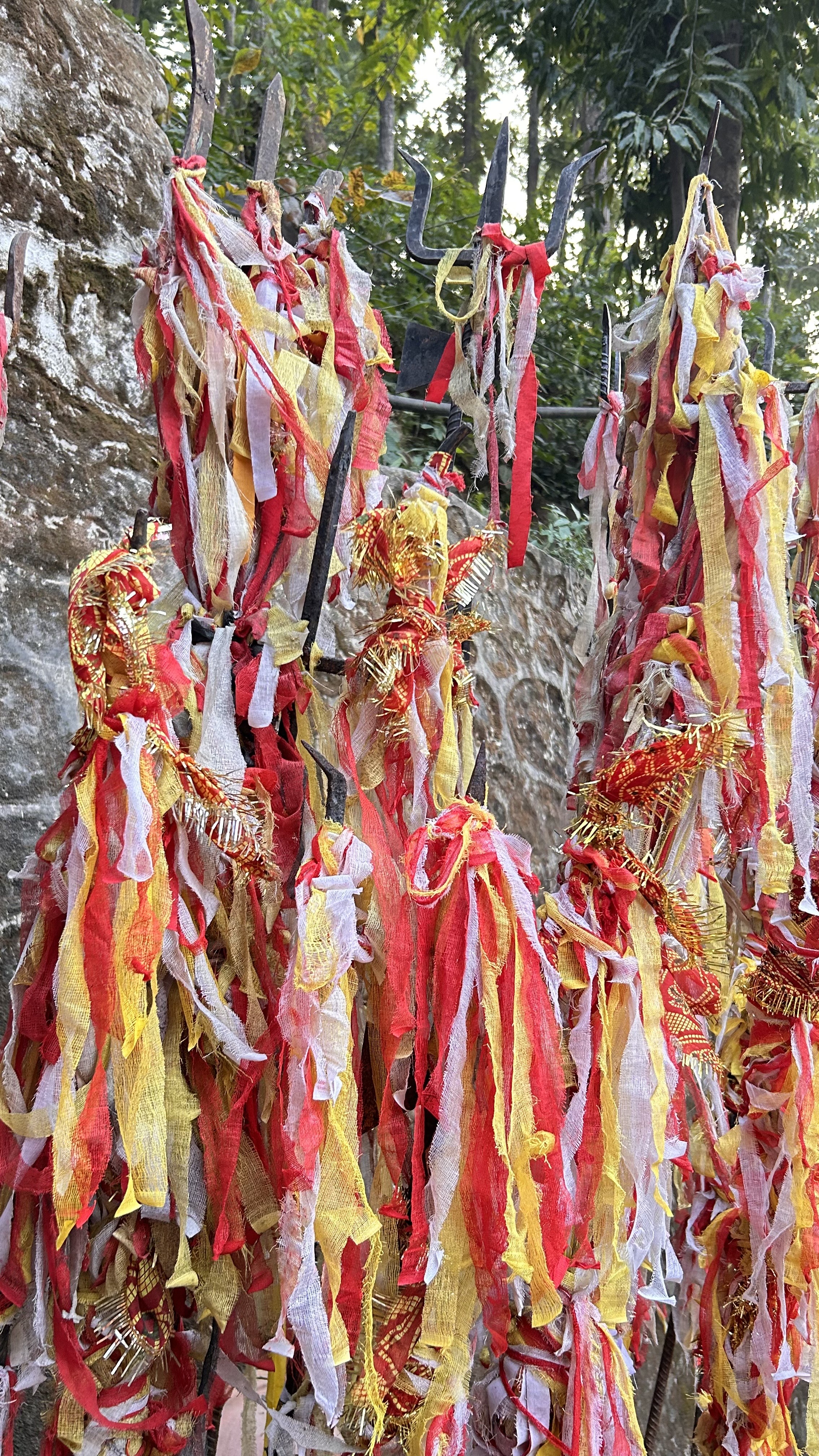 Tall poles draped with red, yellow, and white fabric, creating a vibrant, fluttering effect.