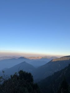 
A panoramic view of rugged mountains under a clear blue sky. 