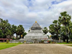 The historic That Makmo stupa at Wat Wisunarat in Luang Prabang, Laos, stands in a peaceful courtyard, reflecting centuries of Lao Buddhist heritage.