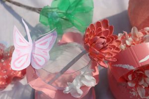 A close-up view of a colorful arrangement of artificial flowers and decorations.