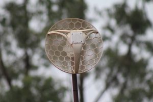 A network mesh trap (wifi extender) with a beautifully blurred background
