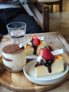 
A wooden serving board features two delicious desserts.