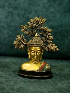 A calm Buddha statue with a decorative tree design, placed against a soft background. The golden tones create a peaceful mood in Kozhikode, Kerala.