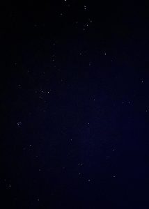 Bright stars and constellations shining in a dark, clear night sky