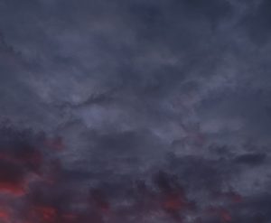 Photo of the sky in Costa Rica at different times and weather, in this case a cloudier sunset.
