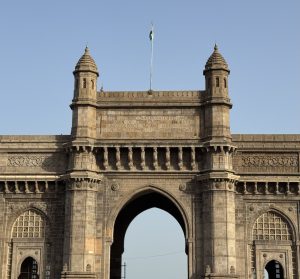 
A close-up view of the Gateway of India, a monumental stone arch with intricate architectural details.