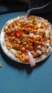 A chana bhel sold on Indian Railways is a snack made from fried chana (lentils) mixed with onion, tomato, lemon juice, and other spices.