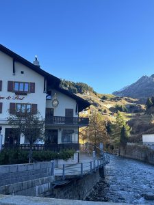View of the Swiss mountains through a bridge and view of the river