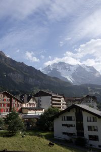 Alpine village of Wengen in Switzerland with traditional buildings and surrounding mountains.
