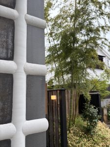 A close-up of a textured gray and white wall with horizontal lines in Kurashiki, Okayama.